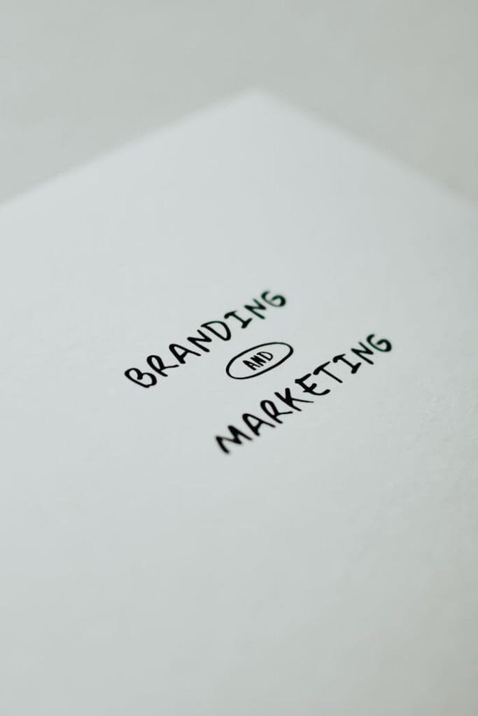 pexels-photo-7661411 Minimalistic design showcasing 'branding and marketing' text for business strategy visuals.